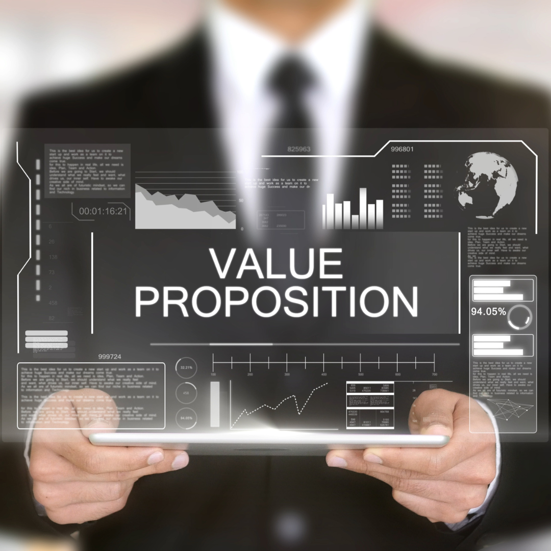 A business executive holds up a futuristic screen with the words "value proposition" displayed.